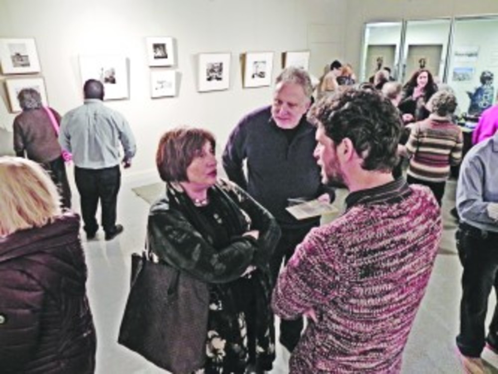Ben Peter took the time to talk about his grandfather’s photography with guests  during the opening reception of “Your Fortunate Eyes” at gallery(401).